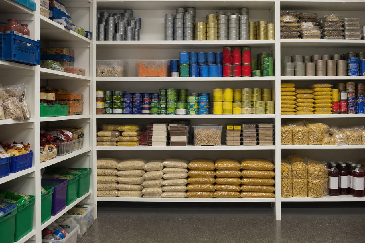 Shelves stocked with canned goods and dry food